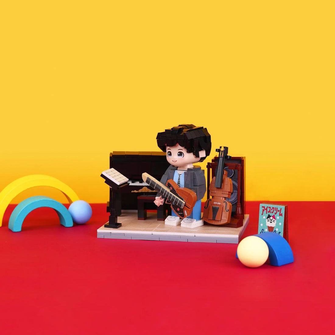 Little Musician Studio kids instrument brick set in a colorful red studio scene
